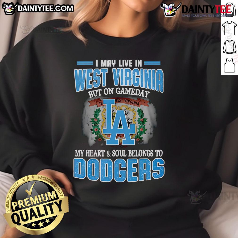 Good I May Live In West Virginia But On Gameday My Heart And Soul Belongs To Dodgers Sweatshirt Cozy Dodgers sweatshirt with 'Good I May Live In West Virginia' slogan, perfect for game day and baseball fans.