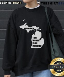 Good I Stand With That Woman From Michigan sweatshirt displayed on a hanger, showcasing its vibrant design and colors.