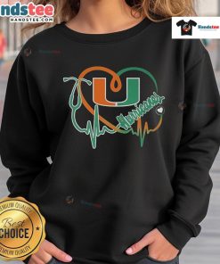 Alt Text: Cozy Good Miami Hurricanes Caring Heartbeat Nurse Sweatshirt featuring vibrant team colors and a heart design.
