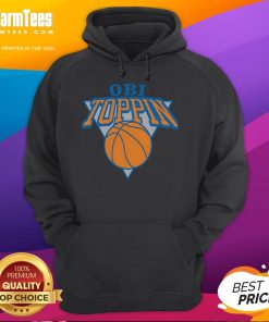 Obi Toppin wearing a stylish New York Knicks hoodie, showcasing team spirit and fashion in vibrant colors.