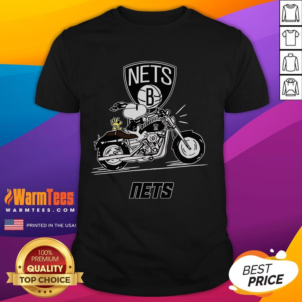 Good Snoopy And Woodstock Driving Motorbike Brooklyn Nets T Shirt Alt Text: Good Snoopy and Woodstock riding a motorbike on a Brooklyn Nets T-shirt, showcasing vibrant colors and playful design.