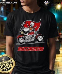 Alt Text: Snoopy and Woodstock riding a motorbike on a Tampa Bay Buccaneers T-shirt, showcasing team spirit and fun.