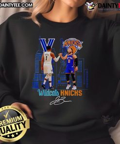 Jalen Brunson wearing a Villanova Wildcats sweatshirt, showcasing team spirit in New York Knicks colors.