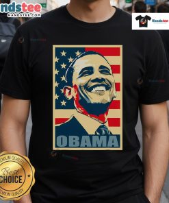 Happy Barack Obama wearing a 44th President t-shirt with an American flag, showcasing his Democrat pride.
