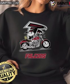 Alt Text: Snoopy and Woodstock joyfully riding a motorbike in an Atlanta Falcons sweatshirt, showcasing their playful spirit.