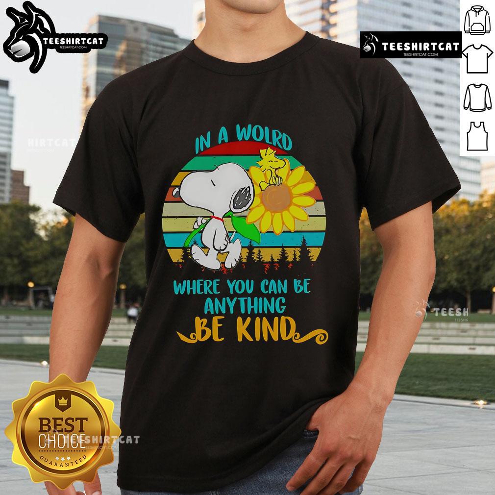 Happy Snoopy Sunflower In A World Where You Can Be Anything Be Kind Retro T-Shirt Alt Text: Happy Snoopy sunflower graphic on a retro t-shirt with the quote In a world where you can be anything, be kind.