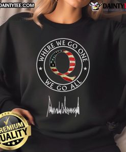 Hot Qanon Where We Go One We Go All Trump Signature Sweatshirt in black with bold white lettering showcased on a hanger.
