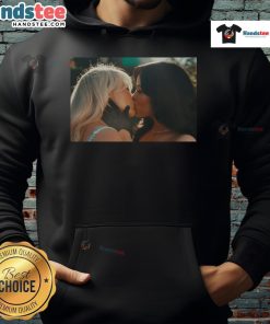 Hot Sabrina Carpenter and Jenna Ortega kiss while wearing a stylish 'Murder Hoodie' in a dramatic scene.