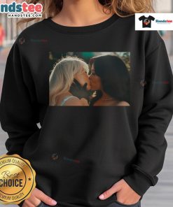 Hot Sabrina Carpenter and Jenna Ortega kiss in stylish murder sweatshirt, showcasing trendy pop culture fashion.