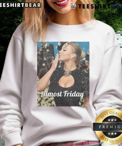 Sydney Sweeney at Met Gala in an 'Almost Friday' sweatshirt, showcasing her unique style and bold fashion choice.