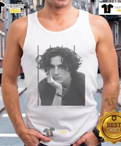 Hot Timothe Chalamet portrait wearing a stylish tank top, showcasing his signature look and captivating expression.