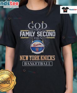 Alt Text: New York Knicks Basketball God graphic tee for men, featuring 'First Family, Second' slogan in team colors.