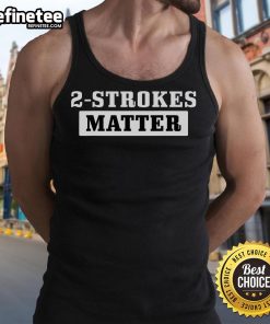 Motocross biker wearing a 'Nice 2 Strokes Matter' tank top during a dirt bike racing event.