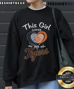 Girl wearing a Detroit Tigers sweatshirt with a heart fingerprint design, showcasing her love for the team.