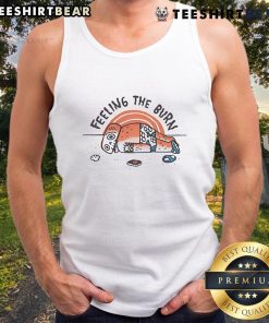 Person wearing a tank top with 'Nice Feeling the Burn' at the beach, showcasing sunburn and summer vibes.