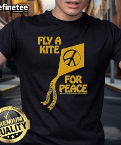 Colorful t-shirt featuring 'Kites Not Bombs' slogan, promoting peace and joy through flying kites for a better life.