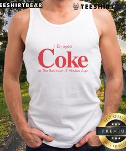 Person in a tank top enjoying a Coke in the bathroom, capturing a relaxed moment from 5 minutes ago.