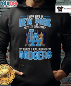 Person wearing a Dodgers hoodie, celebrating game day with pride while living in New York.