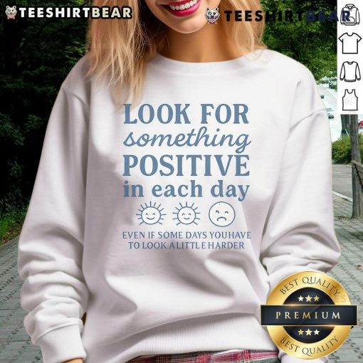Alt Text: Cozy sweatshirt with Look for Something Positive in Each Day slogan, perfect for uplifting daily inspiration.