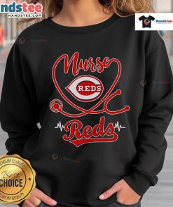 Nice nurse in a Cincinnati Reds sweatshirt, showcasing team spirit and comfort during a casual day out.