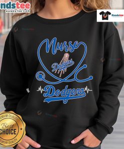 Nice nurse wearing a Los Angeles Dodgers sweatshirt, showcasing team spirit and style in a casual setting.