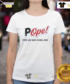 Women wearing Nice Pope Leo Bar Crawl 2025 tees at a lively pub event, enjoying drinks and socializing together.