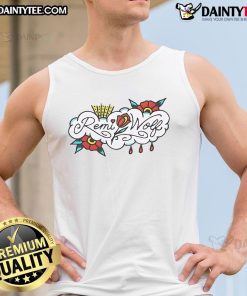 Remi Wolf wearing a colorful flower tank top, showcasing vibrant style and summer fashion trends.