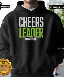 Seattle Seahawks cheerleader in a stylish hoodie, showcasing team spirit and support for the NFL football team.