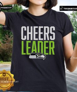 Seattle Seahawks cheerleader in a stylish ladies tee, showcasing team spirit at a game event.