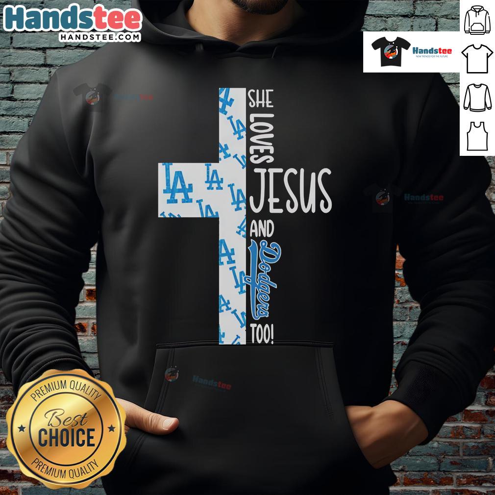 Nice She Loves Jesus And Los Angeles Dodgers Too Hoodie Alt Text: Woman wearing a hoodie that says She Loves Jesus and Los Angeles Dodgers Too, showcasing faith and team spirit.