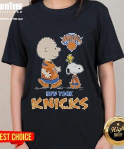 Ladies tee featuring Snoopy and Charlie Brown from The Peanuts in New York Knicks colors, perfect for fans.