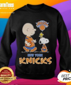 Snoopy and Charlie Brown on a New York Knicks sweatshirt, perfect for Peanuts fans and sports apparel collectors.