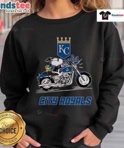 Snoopy and Woodstock driving a motorbike, featured on a Kansas City Royals sweatshirt design.