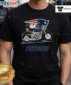 Alt Text: Snoopy and Woodstock riding a motorbike on a New England Patriots t-shirt, showcasing playful team spirit.