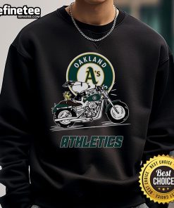 Alt Text: Snoopy and Woodstock riding a motorbike on an Oakland Athletics sweatshirt design.