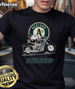Alt Text: Cute Snoopy and Woodstock on a motorbike graphic on Oakland Athletics T-shirt, perfect for fans and casual wear.