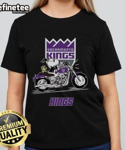 Snoopy and Woodstock riding a motorbike on a Sacramento Kings ladies tee, showcasing playful team spirit.