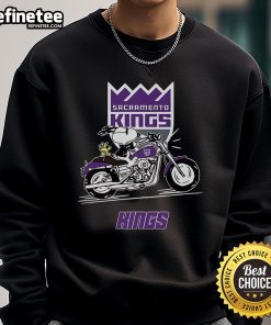 Snoopy and Woodstock riding a motorbike in a Sacramento Kings sweatshirt, showcasing a fun and stylish design.