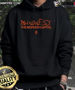 Nice-The-Murder-Capital blindfolded figure wearing an orange hoodie, symbolizing themes of awareness and urban challenges.