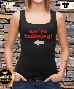 Best friends wearing matching tank tops for Spirit Week Twin Day, celebrating friendship and style together.