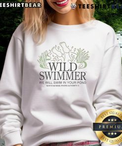 Nice Wild TM swimmer wearing a National Rivers Authority sweatshirt by the pond, promoting eco-friendly swimming.