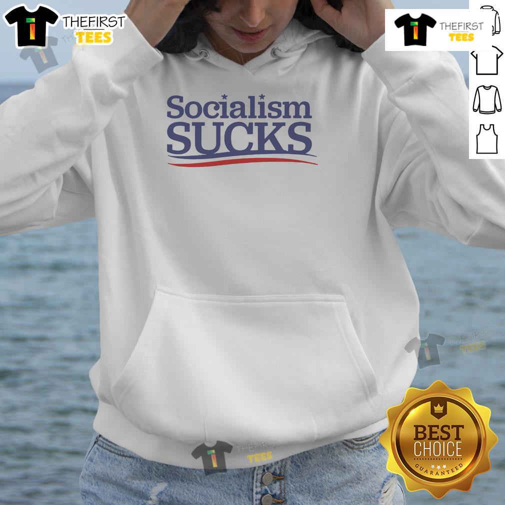 Official Adrianne Curry Socialism Sucks Hoodie Adrianne Curry wearing a 'Socialism Sucks' hoodie, showcasing her bold political statement in casual fashion.