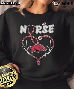 Alt Text: Official Arkansas Razorbacks Nurse sweatshirt featuring It's a Work of Heart design in vibrant team colors.