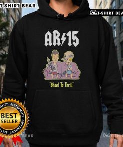 Alt Text: Official Beavis and Butt-Head AR-15 Shoot to Thrill hoodie featuring vibrant graphics on a cozy sofa background.