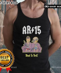 Beavis and Butt-Head AR-15 Shoot to Thrill tank top displayed on a sofa, showcasing vibrant artwork and stylish design.