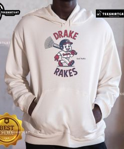 Drake Baldwin wearing the Official Drake Rakes Hoodie, showcasing a stylish urban look in a vibrant street setting.