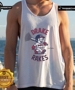 Drake Baldwin wearing a stylish tank top featuring the Drake Rakes logo, showcasing a trendy summer look.
