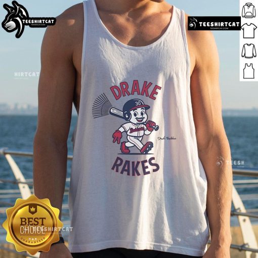 Drake Baldwin wearing a stylish tank top featuring the Drake Rakes logo, showcasing a trendy summer look.