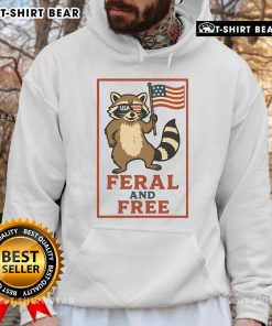 Alt Text: Official Feral and Free Raccoon America Flag Hoodie featuring a raccoon graphic and vibrant American flag colors.