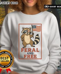 Alt Text: Official Feral and Free Raccoon America Flag Sweatshirt featuring a patriotic raccoon design on a cozy sweatshirt.